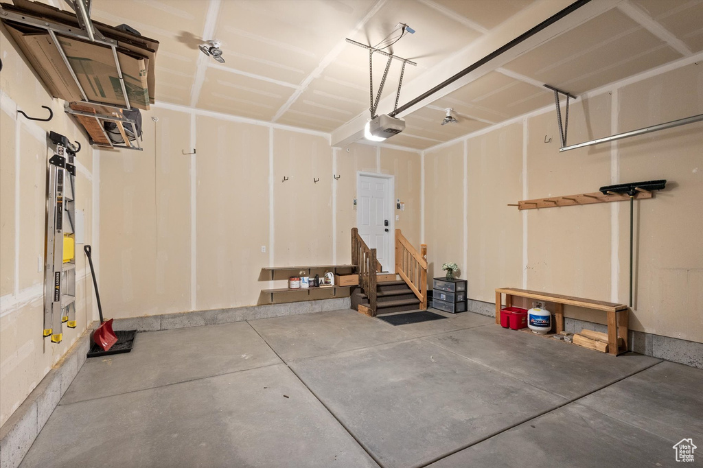 Garage featuring a garage door opener
