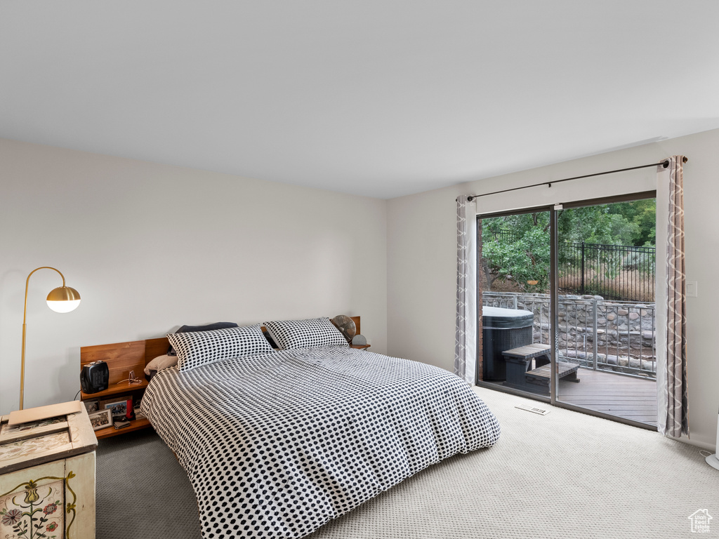 Bedroom featuring carpet floors and access to outside
