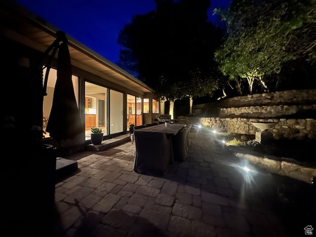 Patio at twilight featuring a patio
