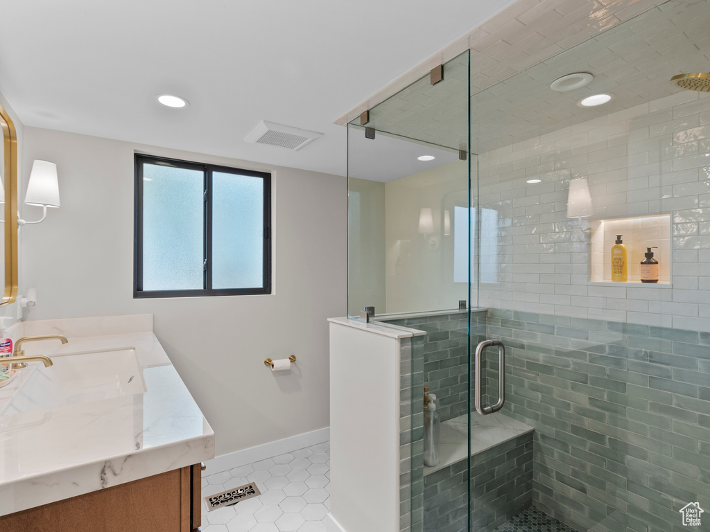 Full bathroom with tile patterned flooring, vanity, a stall shower, and recessed lighting