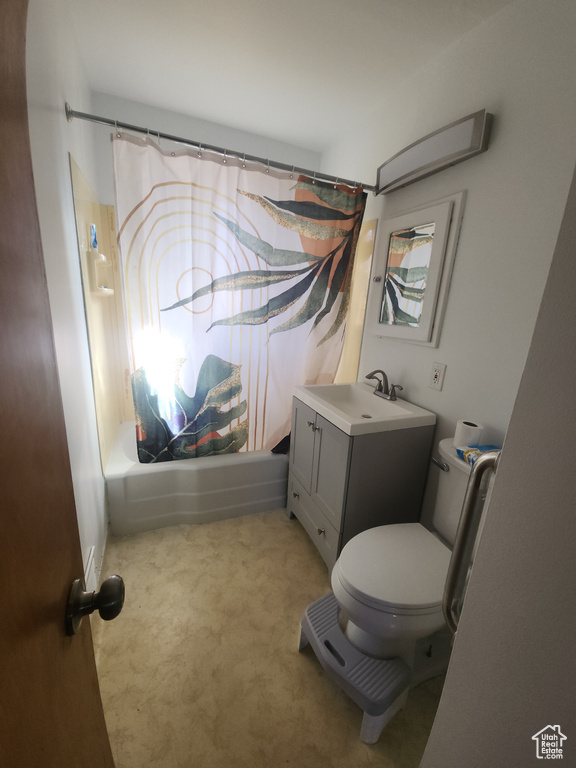 Full bathroom featuring vanity and shower / bath combination with curtain
