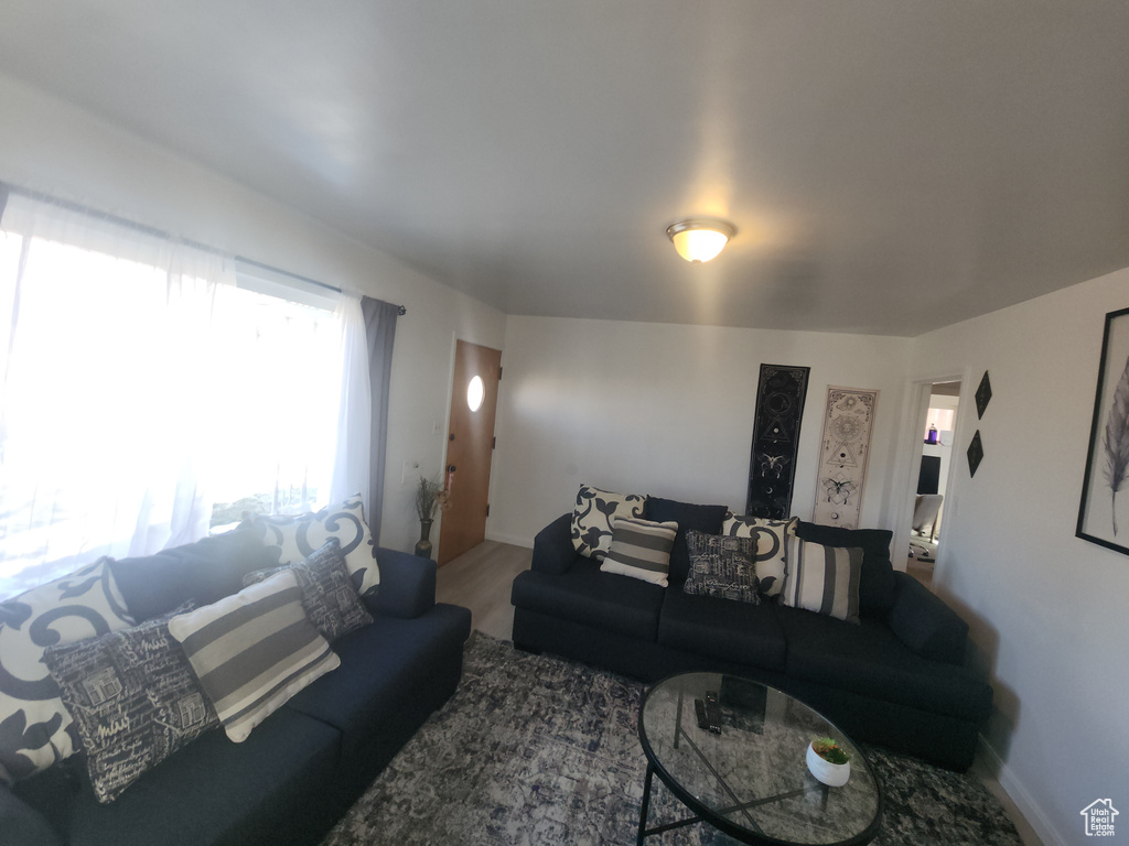 Living room with baseboards and wood finished floors