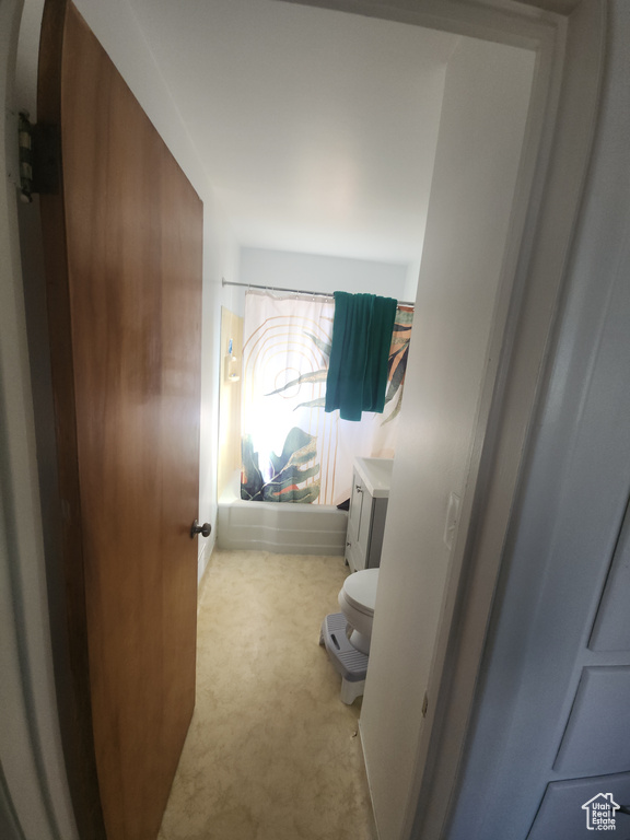 Bedroom featuring carpet flooring and arched walkways