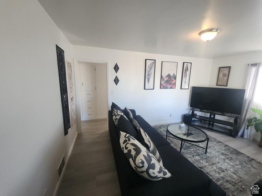Living room with wood finished floors and baseboards