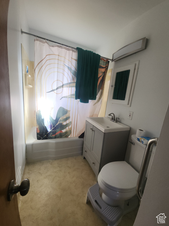 Full bath featuring vanity and shower / bathtub combination with curtain