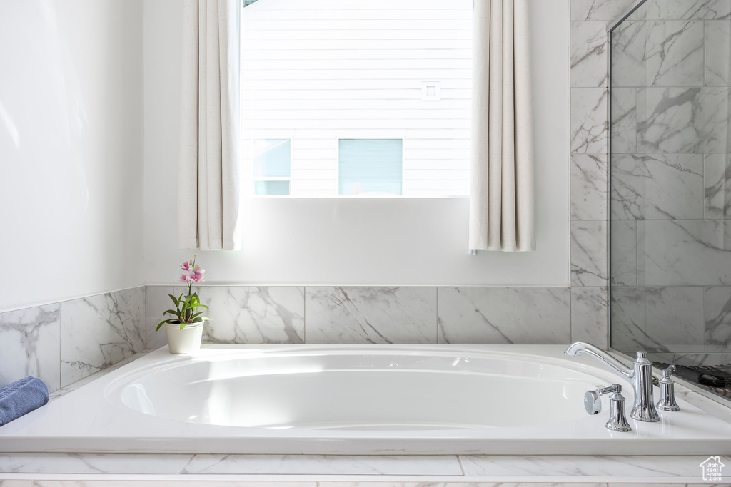 Full bathroom with a bath