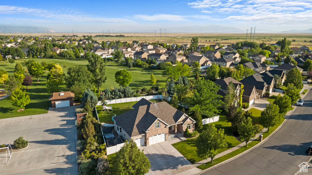 Aerial perspective of suburban area featuring a mountain backdrop