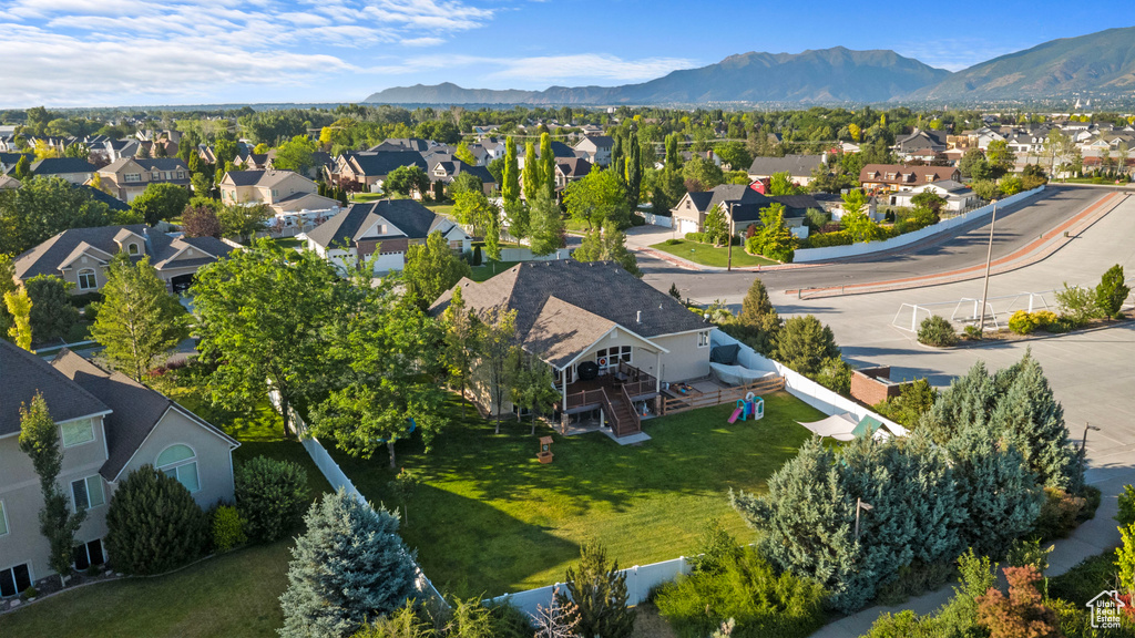 Aerial view of residential area featuring a mountain backdrop
