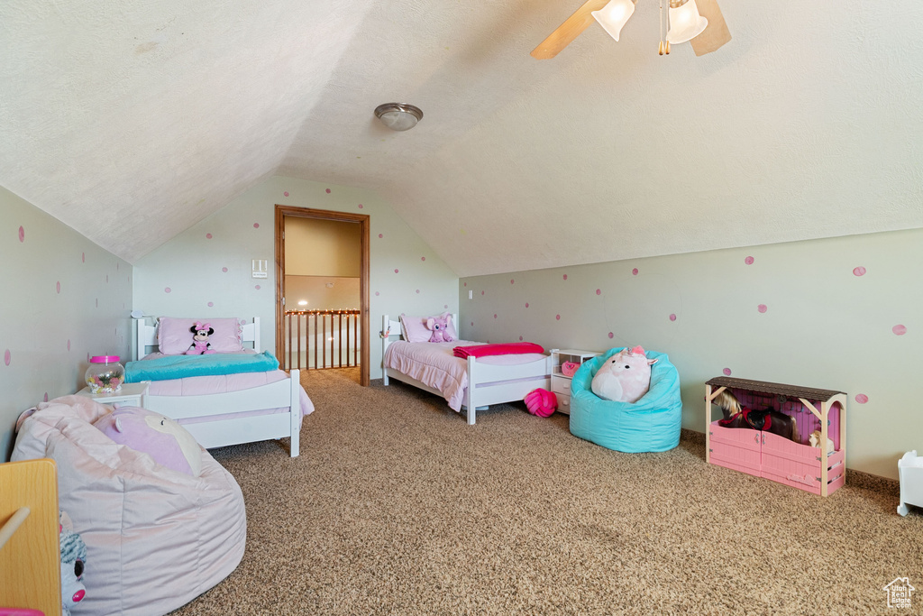 Bedroom with carpet, lofted ceiling, and ceiling fan