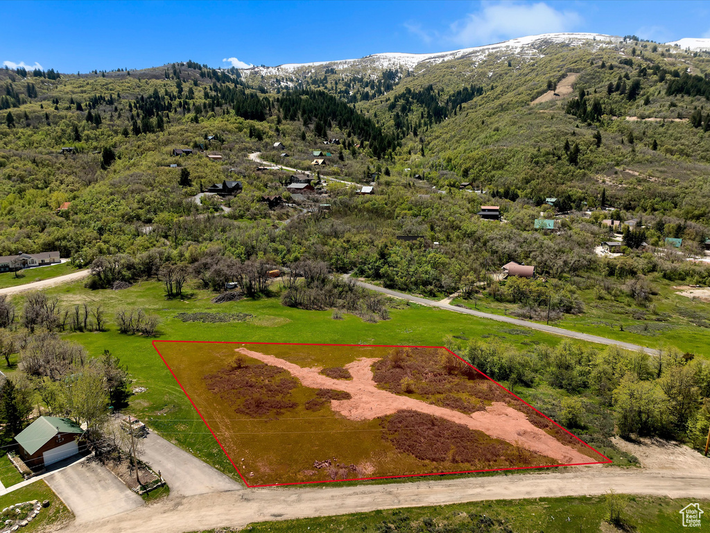 Aerial view of property's location with mountains and property boundaries highlighted
