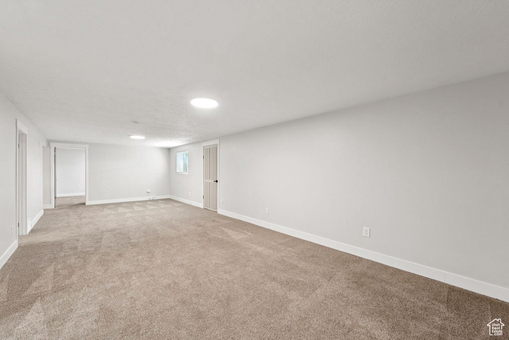 Spare room featuring carpet and recessed lighting