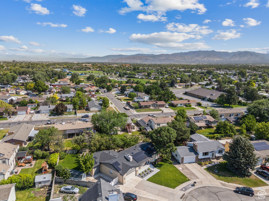 Aerial perspective of suburban area with a mountainous background