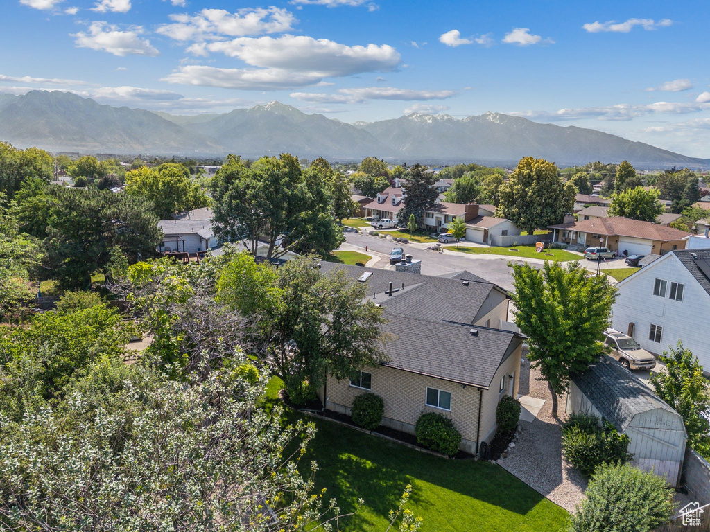 View of mountain backdrop featuring nearby suburban area