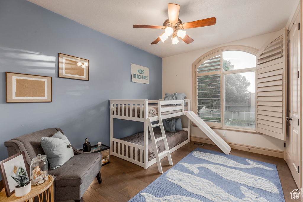 Bedroom featuring wood finished floors and a ceiling fan