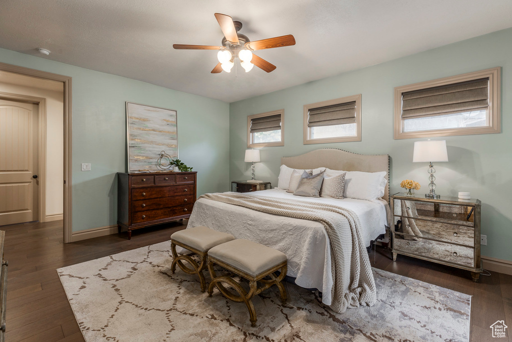 Bedroom featuring dark wood finished floors and ceiling fan