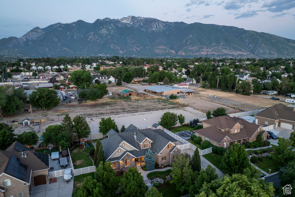 Aerial perspective of suburban area featuring a mountain backdrop