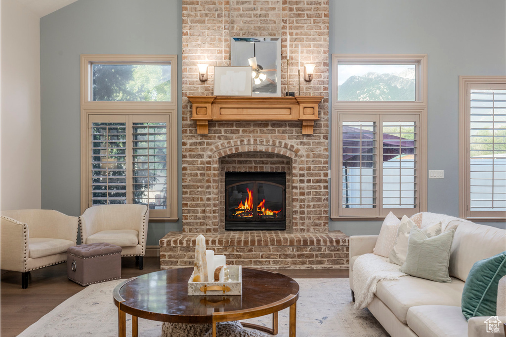 Living area featuring wood finished floors and a fireplace