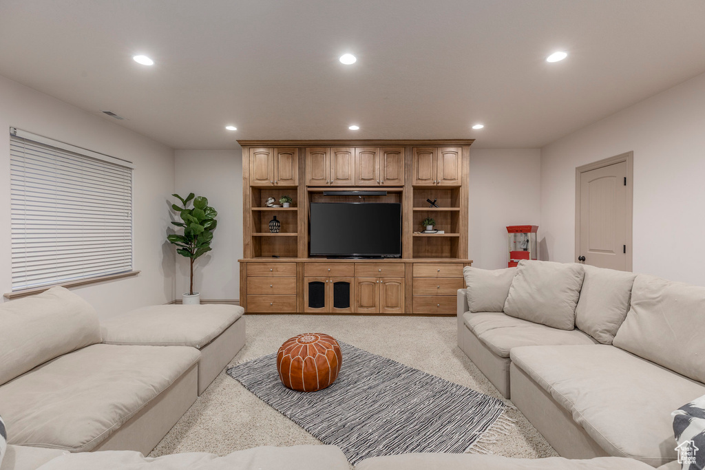 Living room featuring recessed lighting and light colored carpet