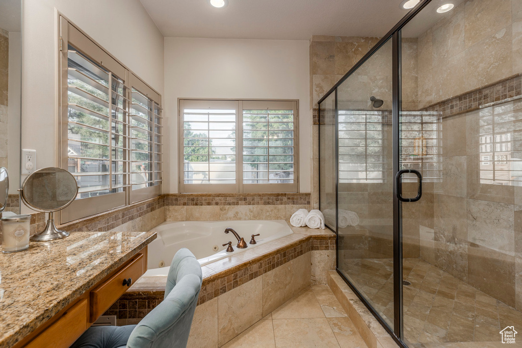 Full bathroom with a tub with jets, a shower stall, recessed lighting, tile patterned floors, and vanity