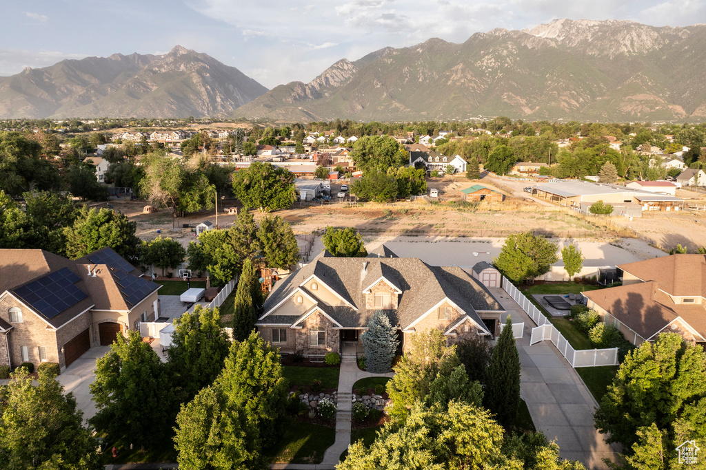 Aerial view of residential area featuring a mountain backdrop