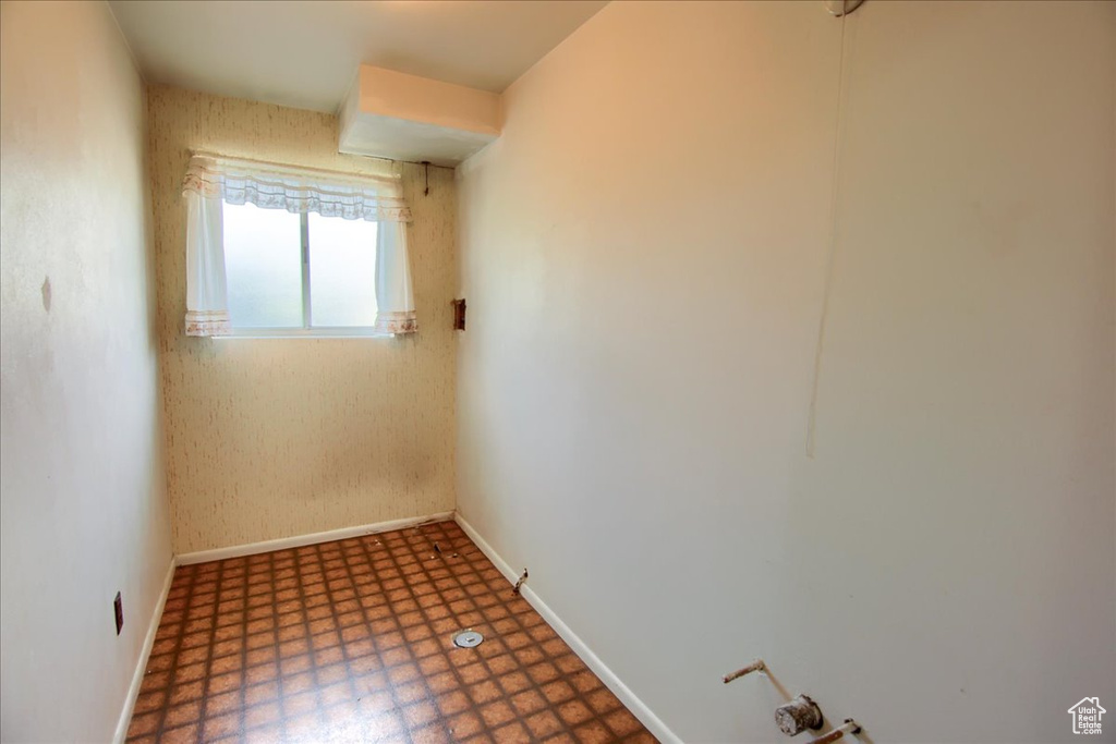 Spare room with tile patterned floors and baseboards