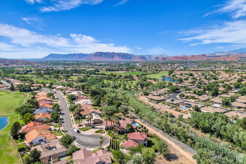 Aerial view of residential area featuring a water and mountain view and a golf club