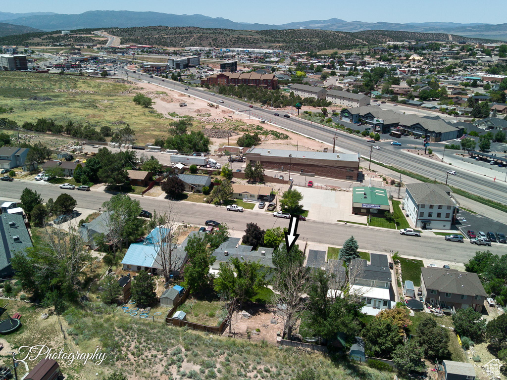 Aerial view of residential area featuring mountains