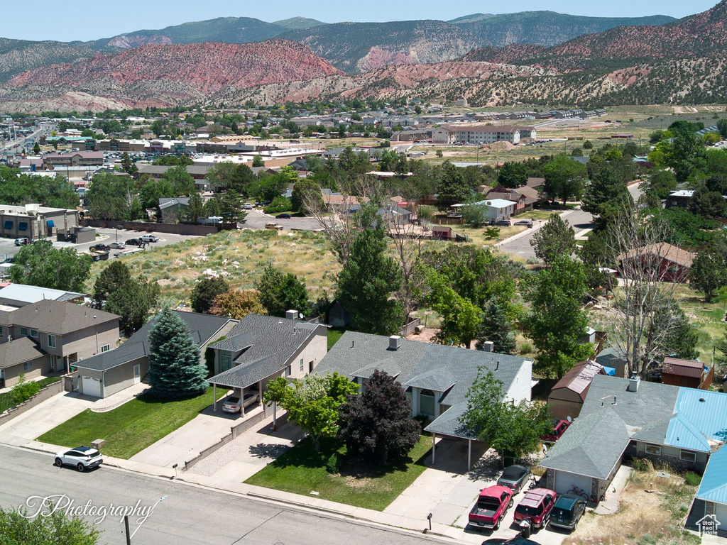 Aerial view of residential area featuring a mountainous background