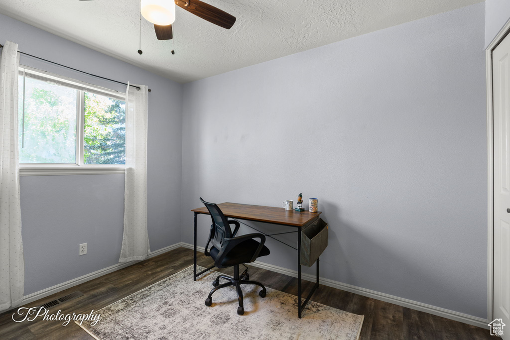 Office featuring wood finished floors, a ceiling fan, and a textured ceiling