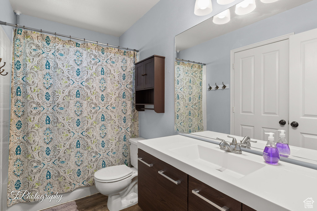 Full bathroom featuring vanity and wood finished floors