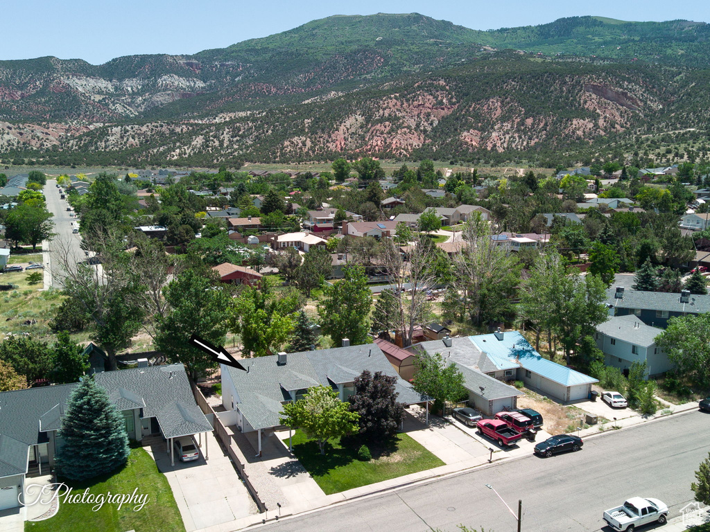 Aerial view of residential area featuring mountains