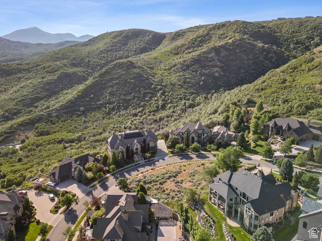 View of property location featuring nearby suburban area and a mountain backdrop