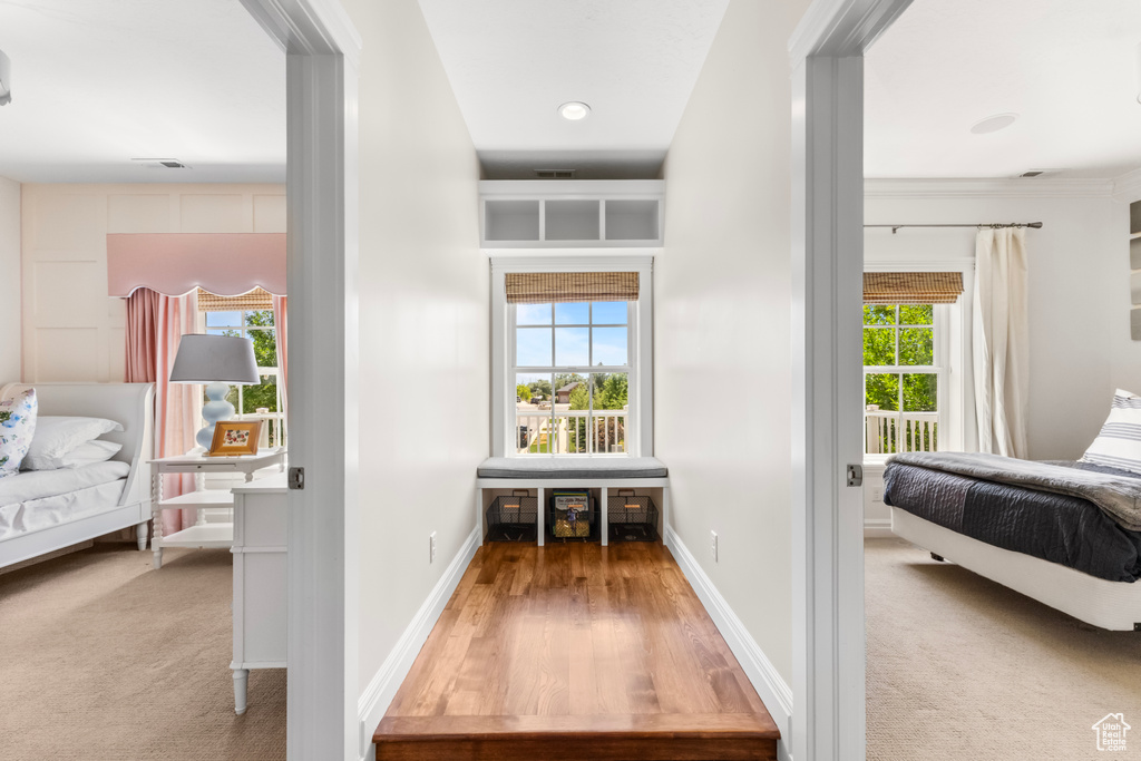 Corridor featuring wood finished floors and baseboards