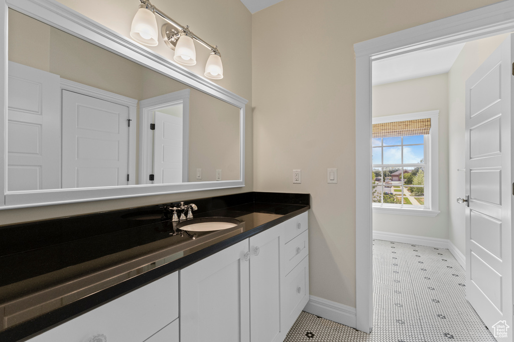 Bathroom with vanity and tile patterned flooring