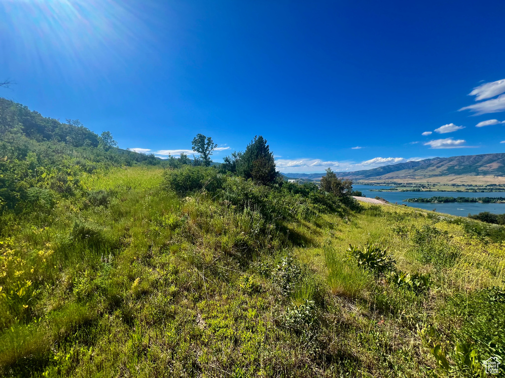 View of mountain backdrop featuring a large body of water