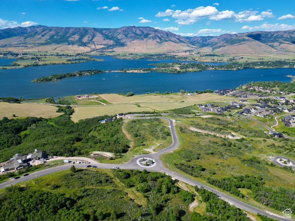 View of property location with a water and mountain view