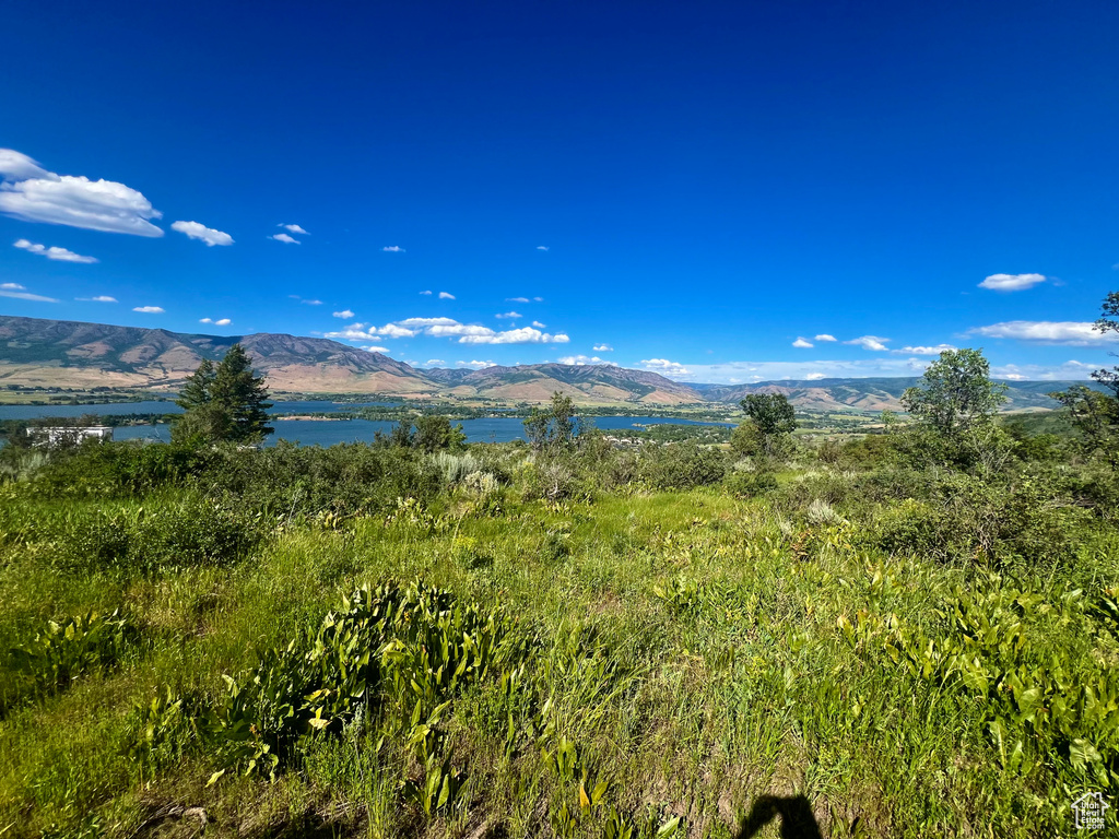 Mountain view featuring a nearby body of water