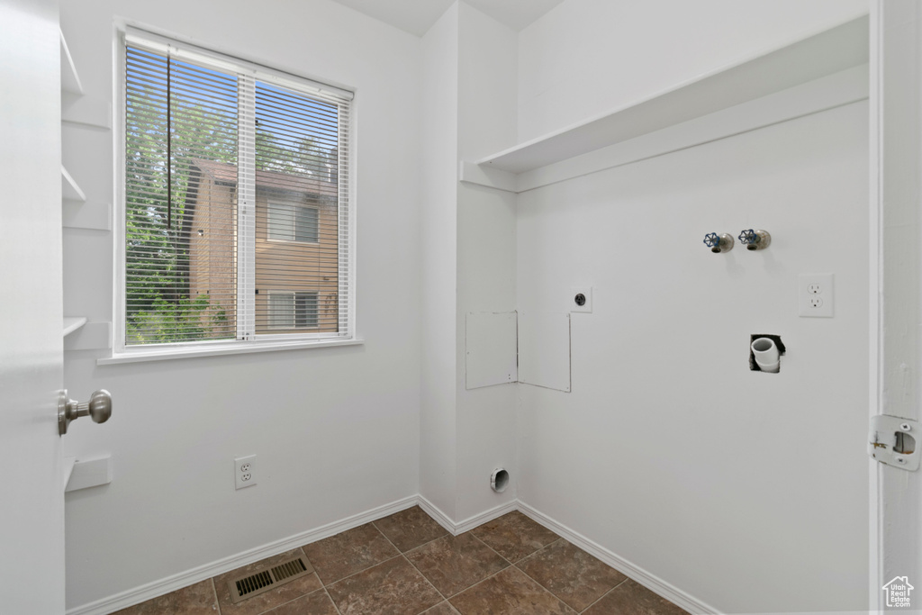 Laundry room with electric dryer hookup and hookup for a washing machine
