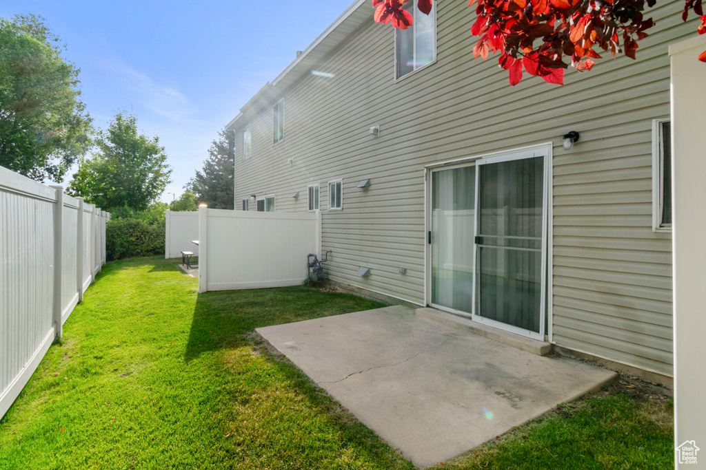 View of yard with a patio area