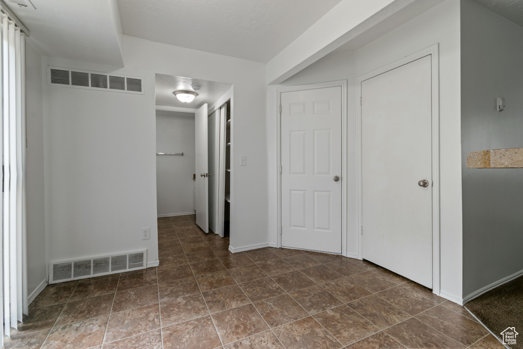 Unfurnished bedroom featuring baseboards