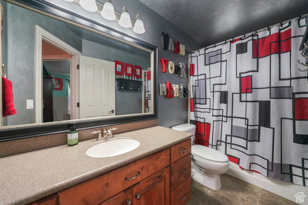 Full bath featuring vanity and a shower with curtain