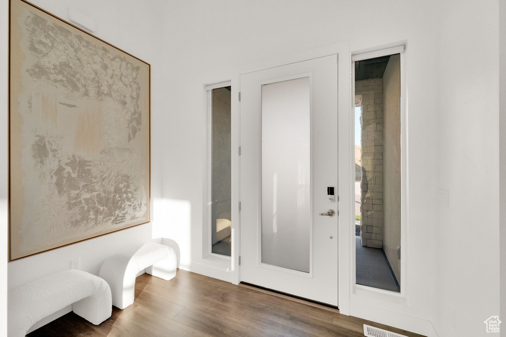 Unfurnished room with wood finished floors