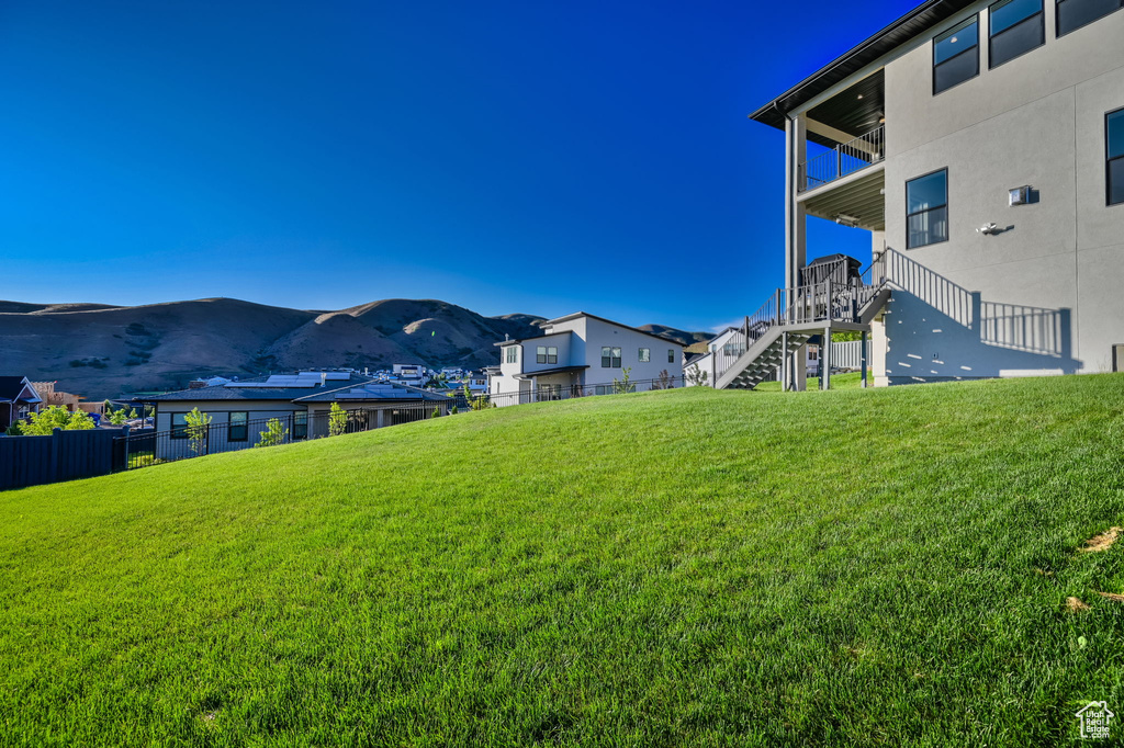 View of yard featuring a mountain view and stairs