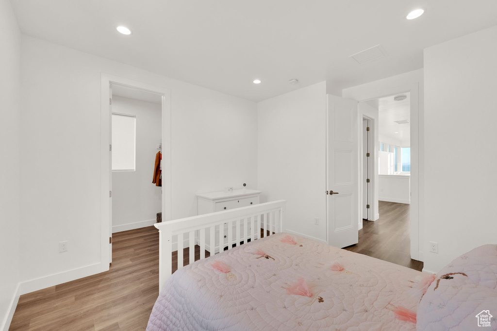 Bedroom featuring wood finished floors and recessed lighting