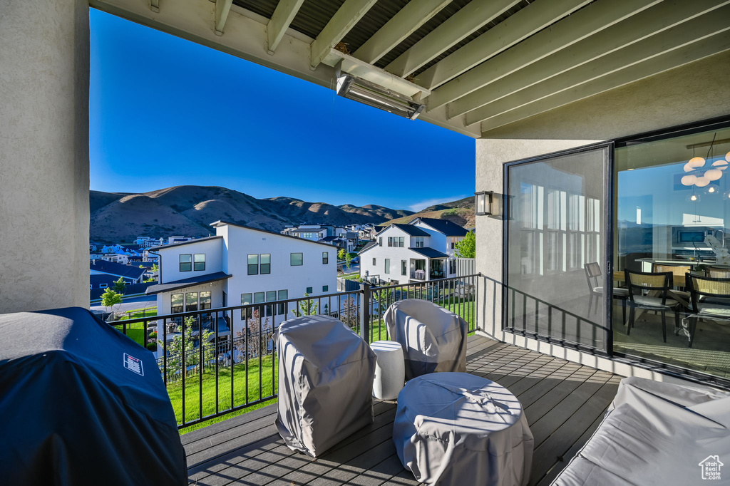 Balcony featuring a mountain view and grilling area