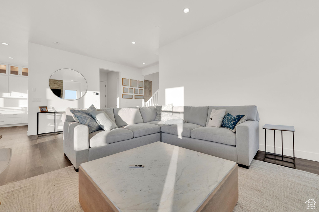 Living room featuring wood finished floors and recessed lighting