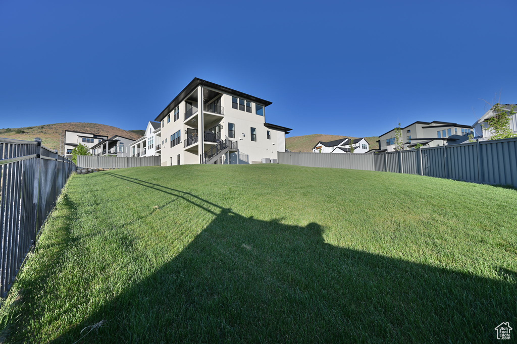 Fenced backyard with a residential view