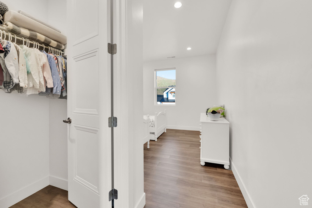 Hall featuring recessed lighting and wood finished floors