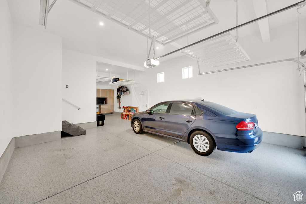 Garage featuring a garage door opener