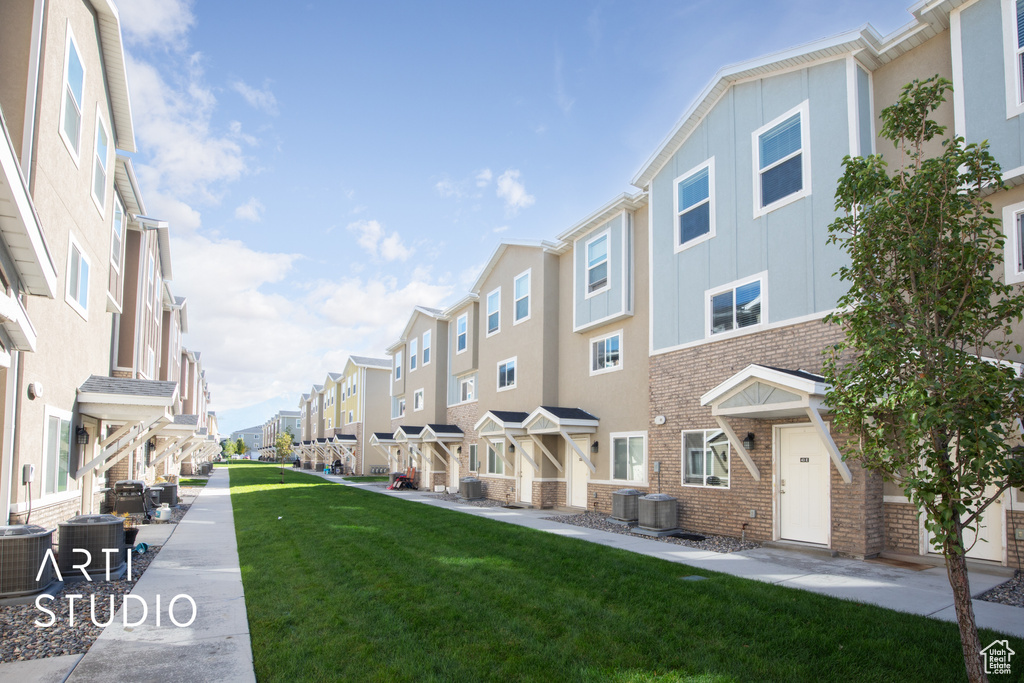 Surrounding community featuring a residential view and a lawn